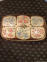 top view showing six floral panels and lacquer detail