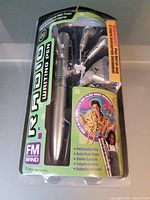 Front view of sealed Innovage Radio Writing Pen package showing pen, earbuds, graphics
