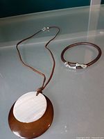 Necklace and bracelet full view on surface