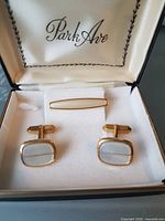 Open Park Ave box showing cufflink pair and tie clip