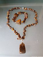 Necklace and bracelet full view showing chip beads and pendant