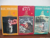 Front view of three VHS cases showing titles Bass Strategies, Fishing for Bass, Flyfishing Strategies