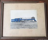 Framed hand-colored photograph under mat showing full view of locomotive