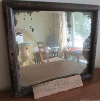 Front view of antique mirror standing upright