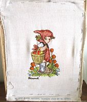 Full view of completed crewel piece on stretcher frame