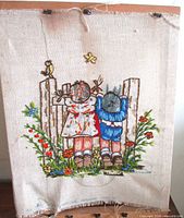 Full view of crewel embroidery on frame