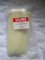 Full sealed pouch of cable ties on towel background