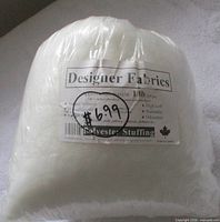 Front of sealed 1 lb bag showing Designer Fabrics label and price sticker