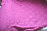 Full view of hot pink fabric spread out