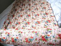 Full bolt of floral lace fabric rolled out