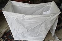 Overall view of white rectangular folding hamper