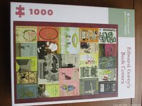 Front of puzzle box showing artwork collage and 1000-piece label