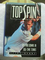 Front dust jacket showing title, subtitle, author, tennis player photo