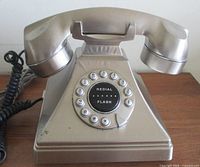 Front view of silver Tiffany corded telephone
