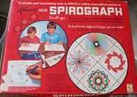 Front lid of Kenner's New Spirograph box showing product branding and sample patterns