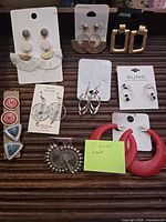 All ten pairs of earrings arranged on tray