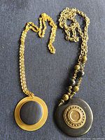 Both necklaces side by side showing design and pendants