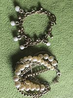 Both bracelets laid flat showing overall designs