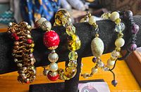 All six bracelets displayed on black bracelet bar