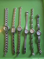 All six wristwatches laid out