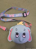Front view of Dumbo silicone purse with full printed strap visible