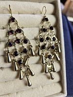 Front view of both earrings showing overall design and stones