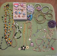 Full lot laid out showing rings tray, necklaces, bracelets, bangles and hair accessories