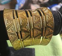 Front view of cuff showing embossed triangular pattern and cutouts