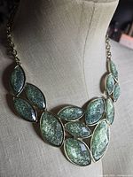 Necklace on display form showing overall design