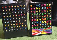 Both display cards showing all earrings