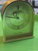 Front view of gold-tone Seiko quartz chime alarm clock