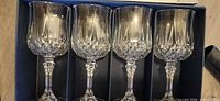 Four of the crystal wine glasses in the fitted box