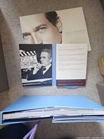 Overall view of slipcase, hardcover book, booklet and interior folder