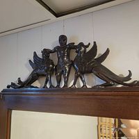 Close-up of phoenix and cherub crest detailing