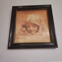 Full view of framed portrait on wall