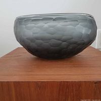 Side profile of smoked faceted glass bowl