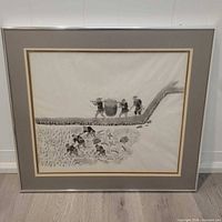 Front view of framed artwork showing entire composition and frame