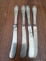 Four knives laid out showing full view