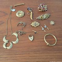 All jewellery pieces laid out on wood surface