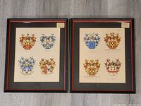 Both framed armorial prints side by side