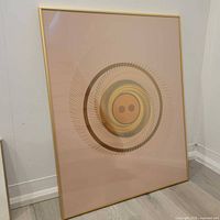 Full view of framed abstract print in corner of room