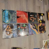 All eight record jackets laid out on floor