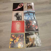 Front view of all eight album covers laid out