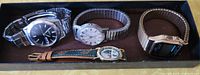 Tray showing all four watches side by side