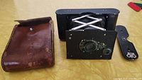 Camera body, leather case, metal cover