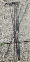 Full view of all 11 cast iron stakes laid out