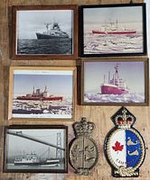 Front view of all five framed photographs and two plaques
