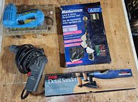 Overview of Craftsman drywall screwdriver, Nailmaster brad tool, Mastercraft bit set, Ryobi detail sander box