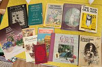 Group shot of eleven books showing main craft titles on yellow surface