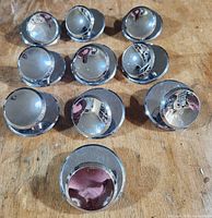 Front view of all ten chrome knobs with backplates